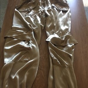 Satin full length pants, fashionable pockets.